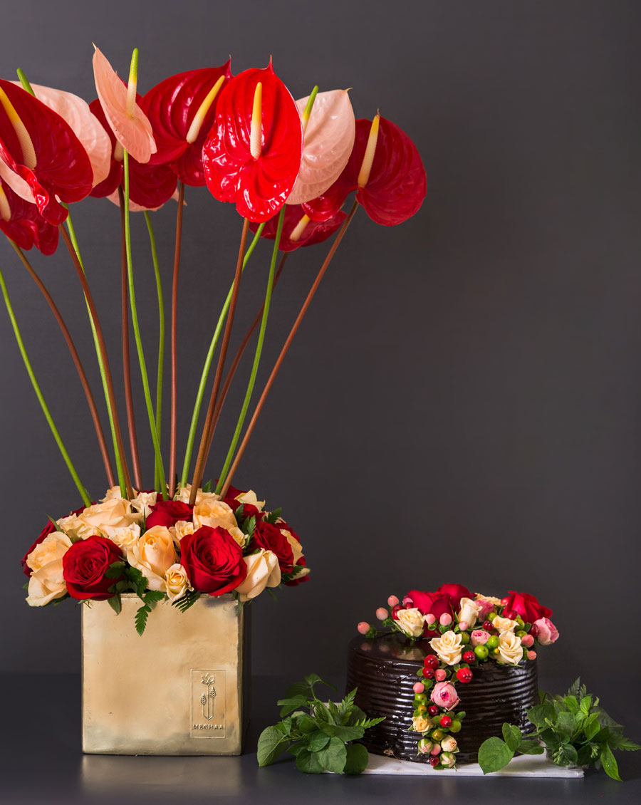 Chocolate cake paired with fresh premium flowers for special gifting